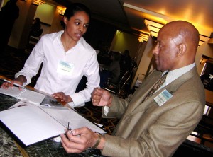 Walter Middlebrook of The Detroit News talks with Kristina Penny at the Spirit of Diversity job fair.