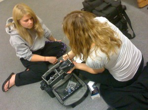 Alex Chudler gets prepped for video work by Sarahmaria Gomez, an instructor at the National High School Institute's journalism division at Medill.